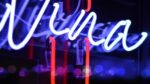 Glowing,Fragment,Of,A,Neon,Sign,,Close-up,,Abstract,Background.,Bokeh