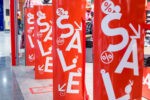 Red,Bright,Sale,Banner,On,Anti-thieft,Gate,Sensor,At,Retail