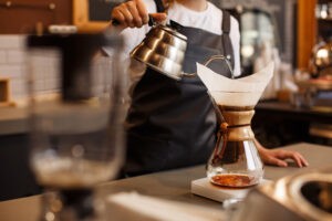 Professional barista preparing coffee